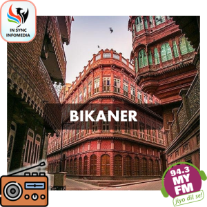 Radio broadcasting microphone with Bikaner cityscape background